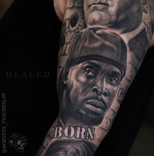 A powerful black and gray tattoo featuring a man and a meaningful quote, expertly done by Slava.