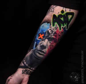 Unique lettering meets surrealism in this forearm tattoo featuring a statue and meaningful quote by Slava.