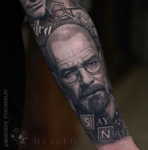 Celebrate the iconic Bryan Cranston character with this black and gray forearm tattoo by artist Slava. Perfect for Breaking Bad fans.