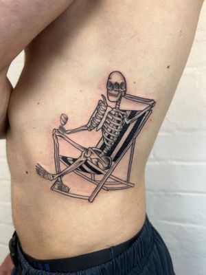 Fine line tattoo on ribs by Jack Howard depicting a skeleton sitting on a chair with intricate details.