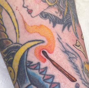 Experience the intricate details of a match and flame in this stunning micro realism tattoo by Rachel Angharad, perfect for your arm.