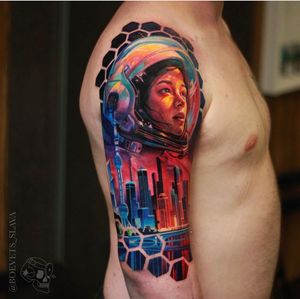 Get lost in the surreal world of an astronaut exploring architectural wonders on your upper arm. Expertly done by Slava.