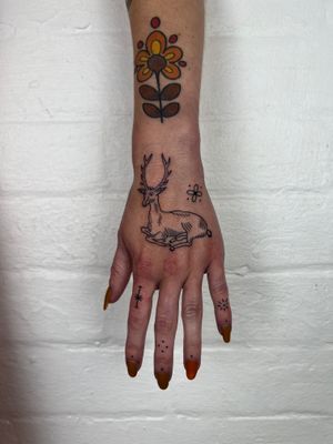 Elegant and intricate fine line deer tattoo on the hand, expertly done by artist Jack Henry. Perfect for nature lovers.