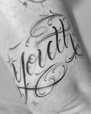 Get a delicate and intricate fine line tattoo with small lettering by tattoo artist Laura May for a unique and stylish look.