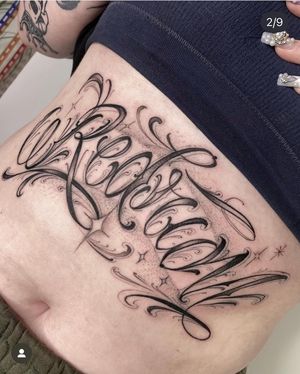 Express yourself with a beautifully crafted black & gray lettering tattoo by the talented artist Laura May. Embrace the art of self-expression and individuality.