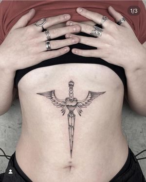 Intricate black and gray fine line dagger tattoo design, expertly done by talented artist Laura May. A perfect blend of elegance and edge.
