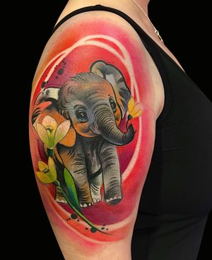 Express your strength and grace with this vibrant new school elephant tattoo by Cloto.tattoos. The watercolor style adds a playful touch to this majestic creature.