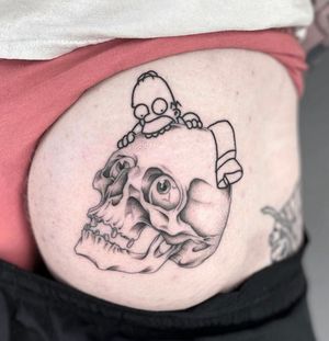 Fine line skull with eyeballs and a Homer Simpson 