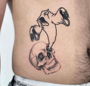 Fine line skull with contrasting bold ghost on the belly 