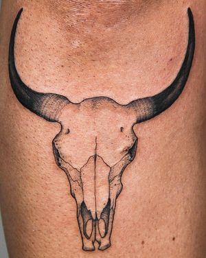 Unique blackwork tattoo of a cow skull done in an illustrative style by the talented artist Andrew Garinther.
