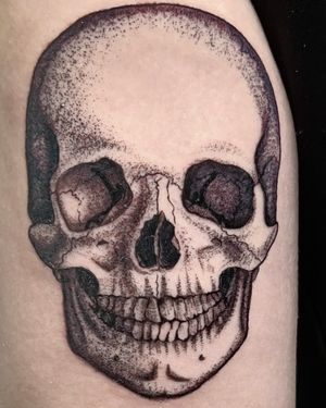 Discover the mesmerizing detail of this dotwork skull tattoo by artist Andrew Garinther. A mix of elegance and edge.
