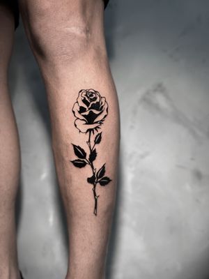Unique and intricate blackwork design of a rose by tattoo artist Andrew Garinther, perfect for those seeking a bold and artistic piece.
