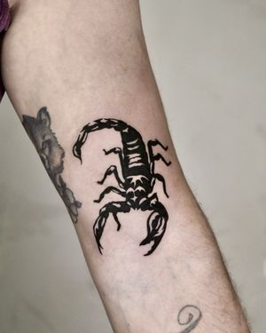 Experience the striking beauty of blackwork scorpion tattoo art by the talented Andrew Garinther. Perfect for those seeking a bold and detailed design.