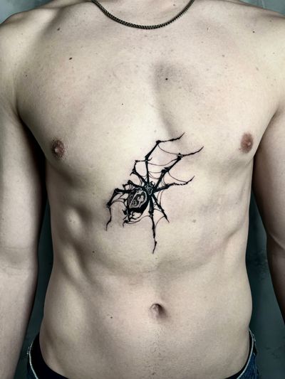 Capture the intricate beauty of a spider with this bold and detailed blackwork design by artist Andrew Garinther.