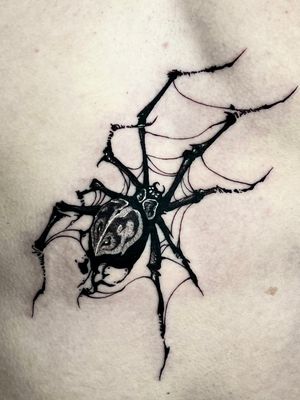 Unique blackwork spider tattoo by artist Andrew Garinther, perfect for those who love dark and intricate designs.