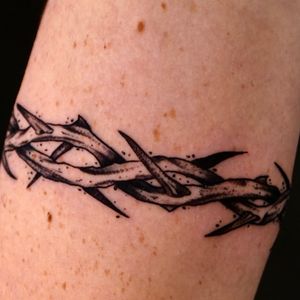 Illustrative blackwork tattoo of intricate thorns by skilled artist Andrew Garinther.