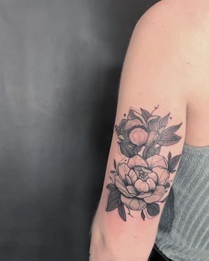 Exquisite black and gray floral design on upper arm, by talented artist Kiky Flore.