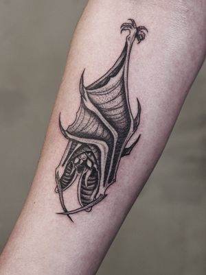 Get a striking blackwork bat tattoo with detailed illustrative style by the talented artist Andrew Garinther.