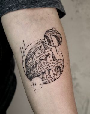 Capture the grandeur of ancient Rome with this fine line tattoo of the iconic Colosseum by Andrew Garinther.