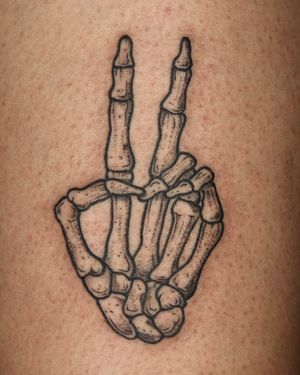 Get inked with a unique illustrative design by Andrew Garinther featuring a skeleton hand motif. Stand out with this intricate and artistic tattoo!