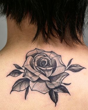 Get a stunning illustrative rose tattoo by the talented artist Andrew Garinther. This beautiful design will surely make a statement.