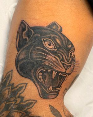Sophie Rose Hunter's stunning black & gray panther tattoo on upper leg combines timeless traditional style with fierce imagery.