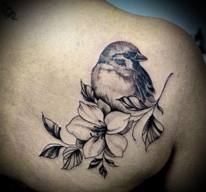 Bird perched on flowers Henshin tattoo studio 