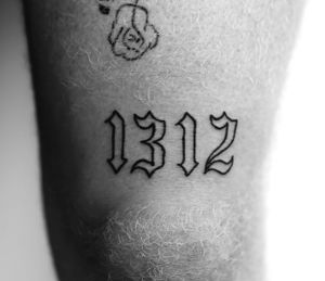 Express your individuality with a custom number tattoo in elegant lettering by Danilo. Stand out from the crowd with this personalized piece.