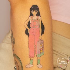 Vibrant anime tattoo featuring Sailor Moon and Sailor Mars in colorful detail by talented artist Mika Tattoos.