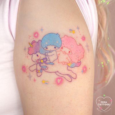 Get a cute and colorful fine line watercolor tattoo of Kiki & Lala from Little Twin Stars by Mika Tattoos.