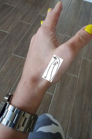 Picasso penguin on base of thumb