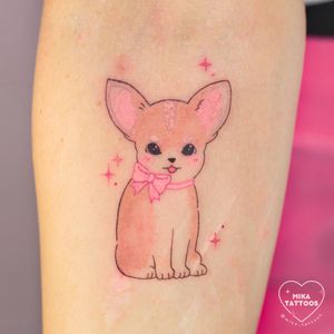 Bring a touch of whimsical charm to your skin with this adorable anime-style dog tattoo in vibrant colors. Perfect for pet lovers!