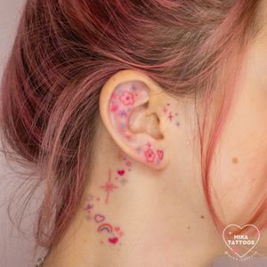 Elegant and delicate floral design by Mika Tattoos, blending ornamental and illustrative styles for a unique ear piece.