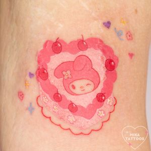 Get a cute and colorful anime-inspired My Melody tattoo by Mika Tattoos, featuring a whimsical watercolor style.