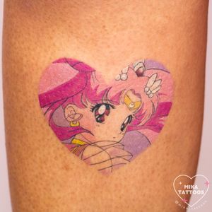 Get a colorful anime tattoo featuring Chibiusa from Sailor Moon in a heart motif by Mika Tattoos.