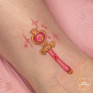 Capture the magic of Sailor Moon with this enchanting anime tattoo by Mika Tattoos. Show off your love for this iconic character with a Sailor Wand design.