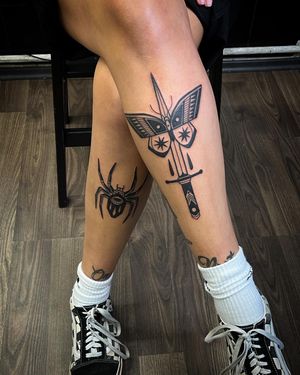 Unique blackwork tattoo featuring a butterfly, spider, and dagger, brought to life by Adrimetric's illustrative style.