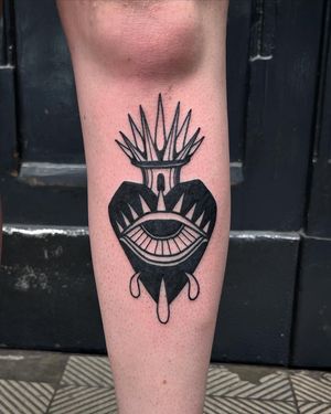 Get a striking illustrative blackwork tattoo of a sacred heart by the talented artist Adrimetric. Embrace the spiritual symbolism and intricate design.