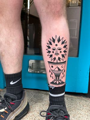 Embrace the power of the sun and sacred chalice with this enchanting illustrative tattoo design by the talented artist Adrimetric.