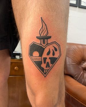 Adrimetric's blackwork skull and sacred heart tattoo features stunning illustrative details for a bold and unique design.