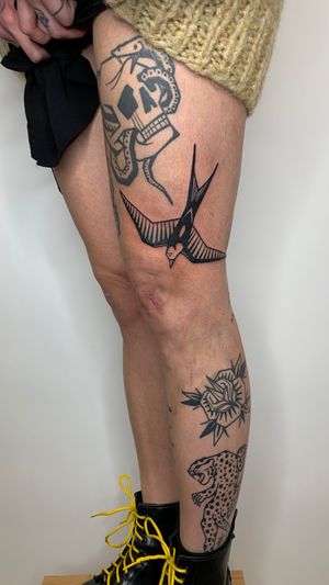 Experience the beauty of blackwork style with this illustrative swallow tattoo by renowned artist Adrimetric.