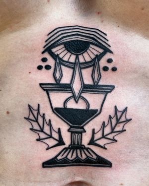 Adrimetric's blackwork style brings a striking combination of an eye, chalice, and laurel design to life.