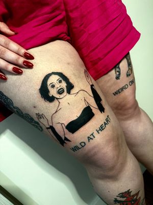Get spooky with this fine line tattoo of a scary woman on your upper leg by the talented Miss Vampira.