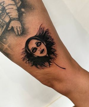Get a chilling tattoo on your upper leg by the talented artist Miss Vampira. Perfect for horror fans.