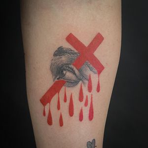 A stylish tattoo by Jenny Dubet featuring an eye and red cross design, on the forearm in chicano and fine line style.