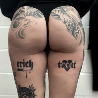 Jenny Dubet's upper leg blackwork tattoo features a heart, dagger, and the words 'trick or treat' in bold lettering.