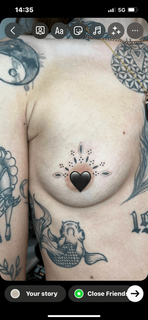Beautiful chest tattoo featuring intricate dotwork ornaments by Indigo Forever Tattoos.
