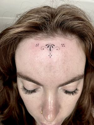 Transform your face with intricate dotwork ornament design by Indigo Forever Tattoos.