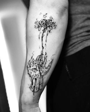 sketch style hands and flowers tattoo on arm