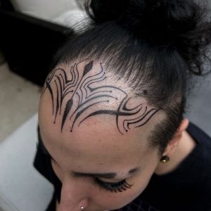 Ornamental forehead tattoo 